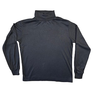 May include: A dark gray turtleneck long-sleeve shirt. The shirt has a high, folded collar and long sleeves with fitted cuffs. The fabric appears to be a smooth, knit material. The shirt is displayed on a white background.