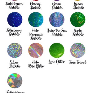 May include: A collection of 12 different glitter colors, including bubblegum, cherry, grape, lemon, blueberry, mermaid, under the sea, apple, silver, rose, lime, and time travel. Each color is displayed in a circle with a descriptive label.