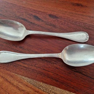 Christofle - Set of 2 table spoons, Crossed Ribbons model - in silver-plated metal