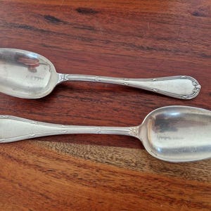 Christofle - Set of 2 table spoons, Crossed Ribbons model, in silver-plated metal