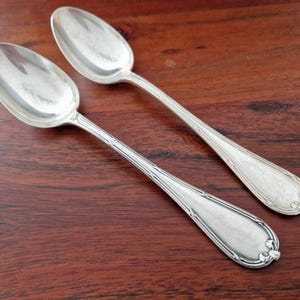 Christofle - Set of 2 dessert spoons, Rubans croisés model - in silver-plated metal