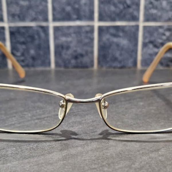 PRADA - Pair of eyeglasses - Beige plastic frame and silver decoration marked Prada