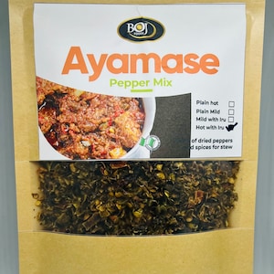 May include: A package of Ayamase Pepper Mix. The package is brown with a clear window showing dried peppers. The top section has the text "Ayamase Pepper Mix" with a picture of the pepper mix. Options for heat level are listed.