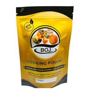 May include: A gold and black stand-up pouch with a zipper closure. The pouch has the text "BOJ Cooking Pouch" and "Cooking and storing steamed food made easy" printed on it. The pouch is BPA free.