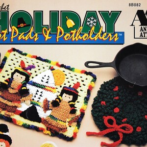 May include: Crochet Holiday Hot Pads & Potholders pattern book featuring a colorful crocheted hot pad with a Native American theme. The book cover also shows a cast iron skillet and a green crocheted potholder with a red bow.