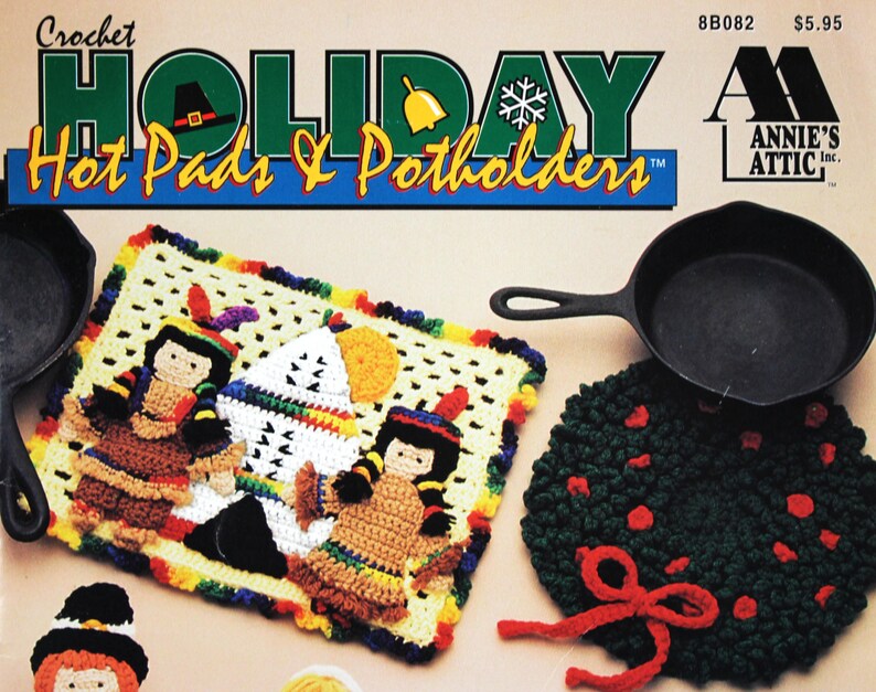 May include: Crochet Holiday Hot Pads & Potholders pattern book featuring a colorful crocheted hot pad with a Native American theme. The book cover also shows a cast iron skillet and a green crocheted potholder with a red bow.