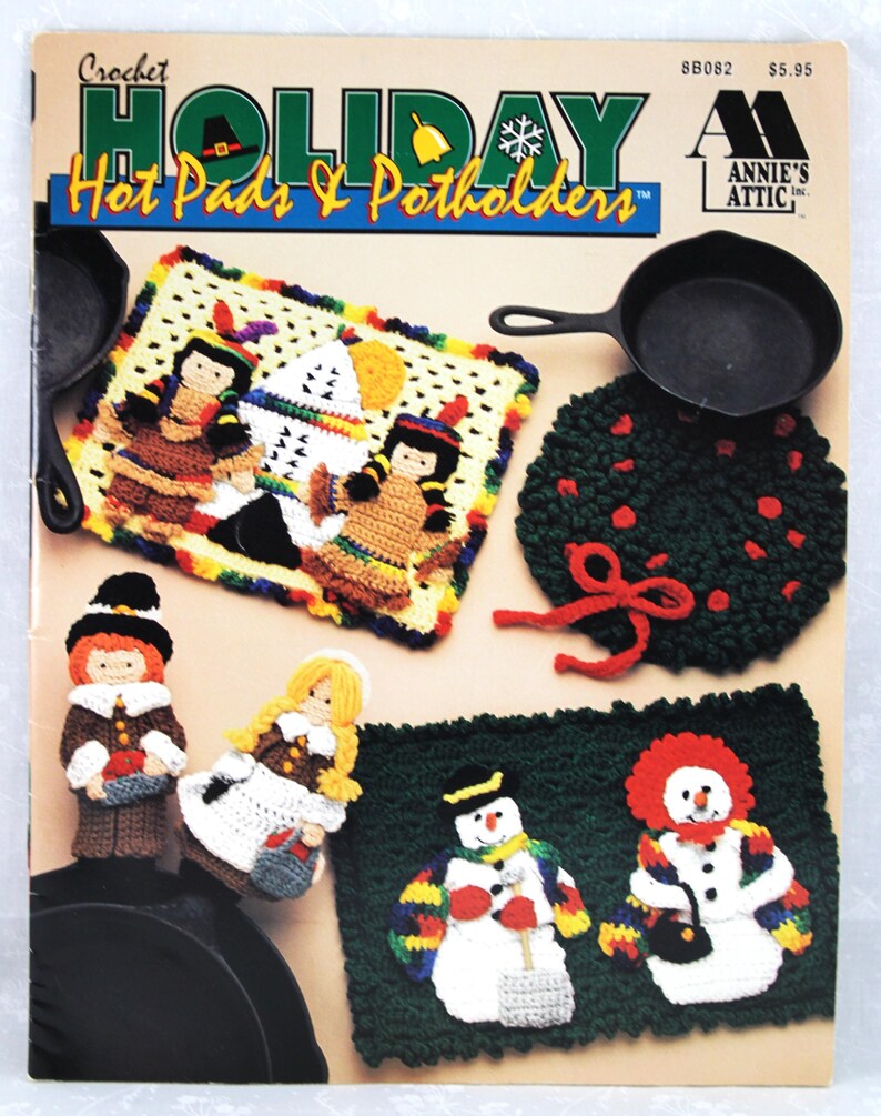 May include: Crochet Holiday Hot Pads & Potholders pattern book by Annie's Attic. The cover features a variety of crocheted designs, including a snowman, pilgrims, and a Christmas wreath.
