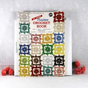 May include: A vintage Star Puritan Crochet Book No. 114 featuring a grid of colorful crocheted square motifs on the cover. The text reads The Famous Puritan Crochet Book, Hats, Bags, Tablecloths, Bedspreads, Blouses, Chair Backs, Doilies, and 25c.