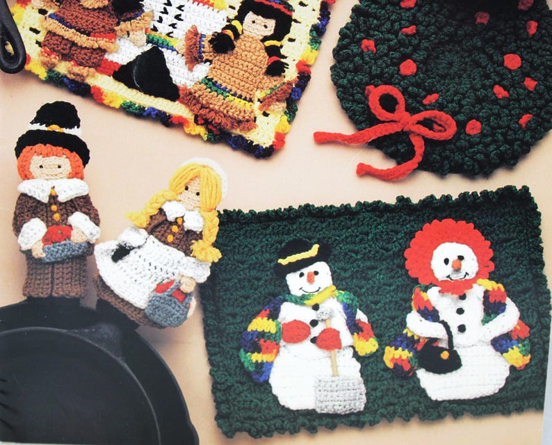 May include: Crocheted holiday-themed pot holders featuring a snowman, a clown, a pilgrim, a pilgrim woman, and a Native American woman. The pot holders are made with colorful yarn and are perfect for adding a festive touch to your kitchen.
