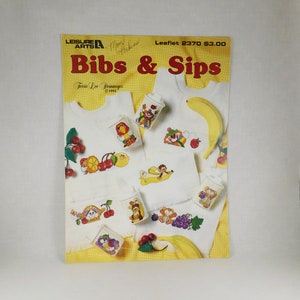 Ulotka z rocznika 1993 „Bibs & Sips” z liczeniem ściegiem X, Leisure Arts nr 2370, projektantka Terrie Lee Steinmeyer, Bibs/Sippy Cups, urocze stworzenia