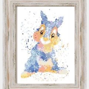 May include: A blue and brown rabbit with a white background. The rabbit is sitting on its hind legs and has its front paws in front of it. The rabbit has a white nose and whiskers.