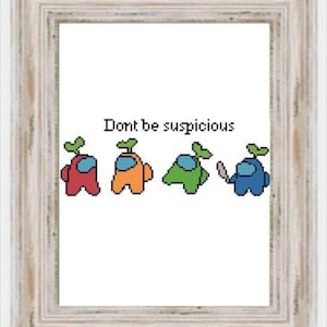 May include: A white framed cross-stitch design featuring four Among Us characters with the text "Don't be suspicious". The characters are red, orange, green, and blue.