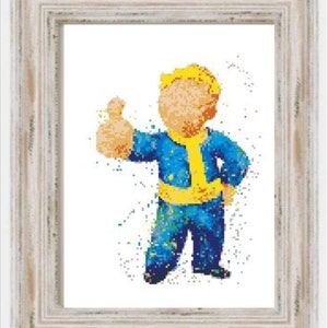 May include: Framed print of a pixelated figure in a blue jumpsuit with a yellow stripe and a yellow helmet, giving a thumbs-up gesture. The artwork is set against a white background and framed in a distressed, off-white wooden frame.