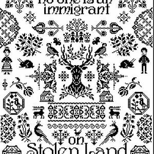 May include: Black and white cross-stitch design with the text "no one is an immigrant on Stolen Land." The design includes a deer, birds, houses, and floral patterns. The style is reminiscent of traditional folk art.