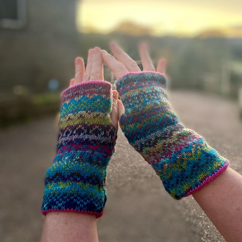 Pink, turquoise and purple fair isle knitted wrist warmers image 1