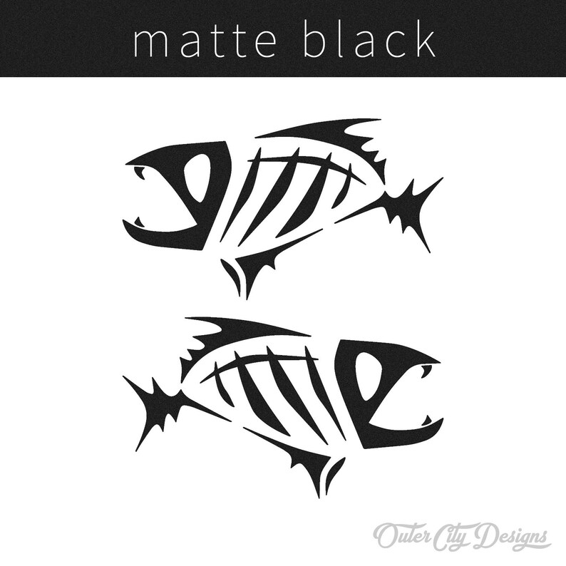 May include: Two black fish skeletons, stylized in a simple, graphic design. The skeletons are facing opposite directions, with their mouths open. The text "Outer City Designs" appears at the bottom of the image.