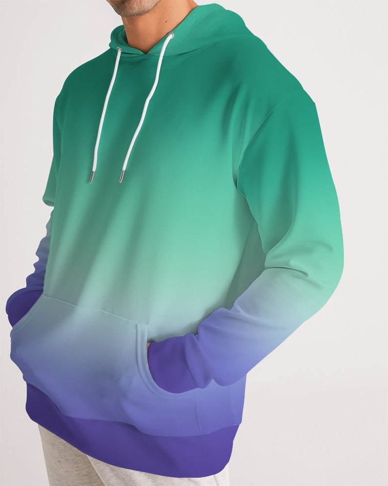 May include: A green and purple ombre hoodie with a drawstring hood and kangaroo pocket.