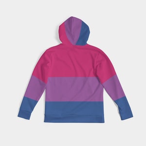 May include: A pink, purple, and blue striped hoodie with a zipper and a hood. The hoodie is a long-sleeved pullover style.