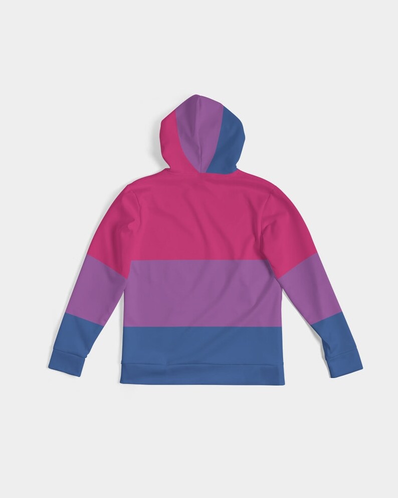 May include: A pink, purple, and blue striped hoodie with a zipper and a hood. The hoodie is a long-sleeved pullover style.