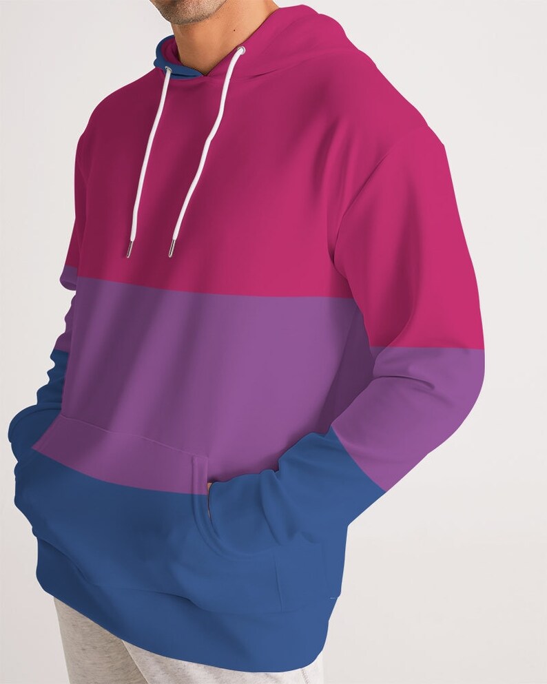 May include: A pink, purple, and blue striped hoodie with a white drawstring.
