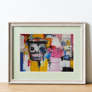 Puede incluir: Una pintura abstracta enmarcada con un estilo colorido y audaz. La pintura presenta una calavera con un ojo azul y un fondo amarillo. El marco es blanco con un paspart&uacute; verde claro.