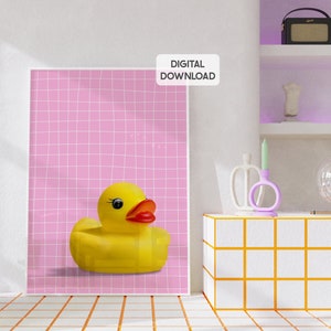 May include: A digital download of a pink and white grid background with a yellow rubber ducky in the center. The text "DIGITAL DOWNLOAD" is in white letters on a black rectangle.