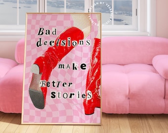 May include: A framed art print with the text "Bad decisions make better stories" in a bold font. The artwork features a pair of red boots on a pink and white checkered background. The print is displayed in a room with a pink sofa.