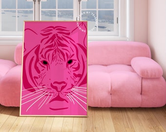 May include: A pink and white tiger face illustration in a gold frame. The tiger's eyes are black and the background is a solid pink color.