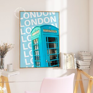 May include: A blue vintage telephone box with the word "TELEPHONE" printed on the side, against a light blue background with the word "LONDON" repeated in white.