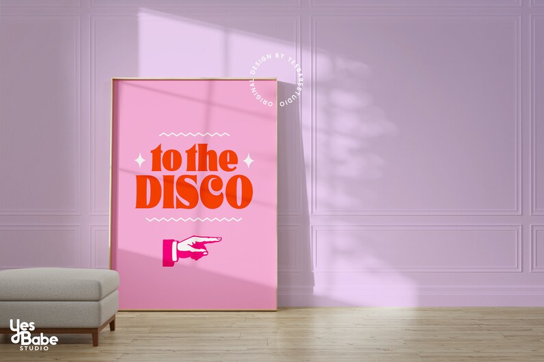 May include: A pink poster with the text "to the disco" in bold orange letters. A white pointing hand is below the text.