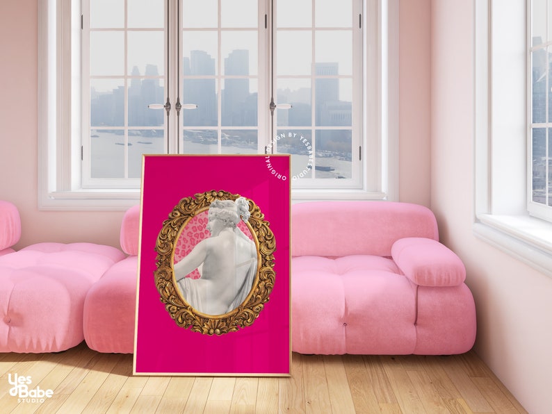 May include: A pink background with a gold ornate frame surrounding a white marble statue of a woman. The frame has a pink and white leopard print background.
