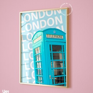 May include: A turquoise blue vintage telephone box with the word "TELEPHONE" printed in white on the front. The box is set against a background of the word "LONDON" repeated in white on a light blue background.