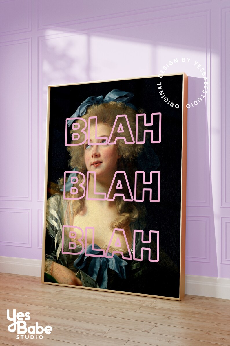 May include: Framed art print featuring a classical portrait of a woman with the word "BLAH" overlaid in pink. The artwork has a gold frame and is displayed against a light purple wall. The print is from Yes Babe Studio.