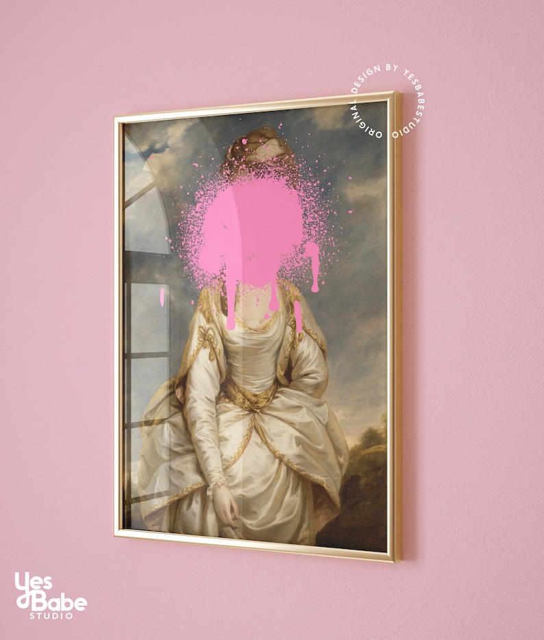 May include: A framed painting of a woman in a white dress with a pink spray paint splatter covering her face. The painting is set against a pink wall.