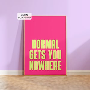 May include: A pink framed poster with the text "NORMAL GETS YOU NOWHERE" in bright green letters.
