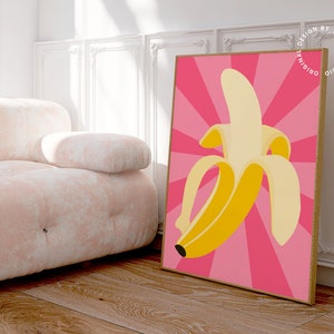 May include: A yellow banana with a pink background and a radial pattern. The text "original design by yesbabe studio" is on the right side of the image.