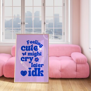 May include: A purple and blue poster with the text "Feeling cute might cry later idk" in a retro font. The poster features a heart with a butterfly and a flower.