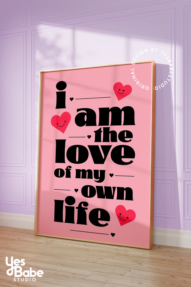 May include: Pink and black typography print with the text "i am the love of my own life" with red hearts with smiley faces.