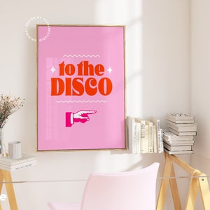May include: Pink and orange poster with the text "to the disco" and a pointing hand graphic.