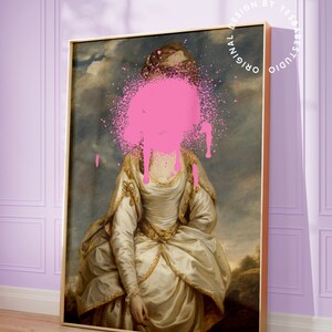 May include: A framed painting of a woman in a white dress with a pink paint splatter covering her face. The painting is set against a light purple wall with white trim. The text "Original Design by Yes Babe Studio" is written in a circle around the painting.