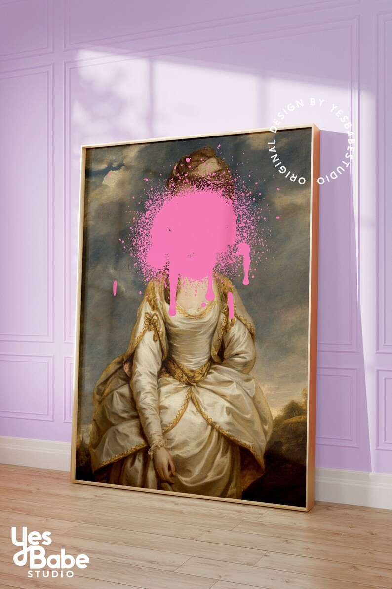 May include: A framed painting of a woman in a white dress with a pink paint splatter covering her face. The painting is set against a light purple wall with white trim. The text "Original Design by Yes Babe Studio" is written in a circle around the painting.