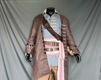 May include: A brown linen coat with a blue and white patterned shirt, brown leather belt with silver chain, and pink and white striped sash. The outfit is worn by a mannequin on a gray background.