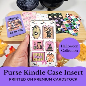 May include: A clear Kindle case insert with Halloween-themed illustrations, including a spooky tree, owl, and bat. The insert is surrounded by other Halloween-themed designs and the text "Purse Kindle Case Insert" and "PRINTED ON PREMIUM CARDSTOCK".