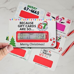 May include: A collection of Christmas-themed gift card holders with red scratch-off areas. The main card reads "BECAUSE GIFT CARDS ARE SO..." and "Merry Christmas!" with a rolled-up bill visible. Other cards say "Merry 67-Mas" and "Nice/Naughty 6-7".