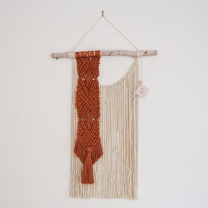 Macrame wall hanging in ivory and rust