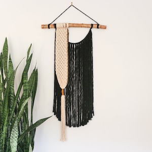 Black and ivory macrame wall hanging with birch pole