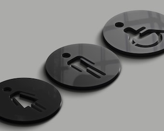 May include: Three black circular signs with white symbols. The signs are for a restroom, with symbols for male, female, and wheelchair accessible.