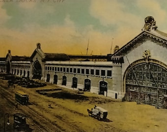 May include: A vintage print of Chelsea Docks, New York City, dating from around 1909, with the text "Chelsea Docks N.Y. City". The image is mounted on a white mat, with a label that reads "White Star Line (Titanic Berth) Amelia Piers circa 1909".
