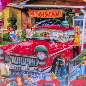 May include: A jigsaw puzzle illustration depicting a red vintage car being washed by children in a driveway. A yellow banner above the car reads CAR WASH SATURDAY, and a small sign in the foreground reads CAR WASH 50c. Bubbles and balloons are visible.