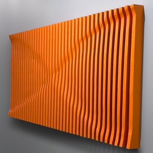 May include: Orange wall art made of wood with a wavy, rippled design. The wood is arranged in vertical strips.
